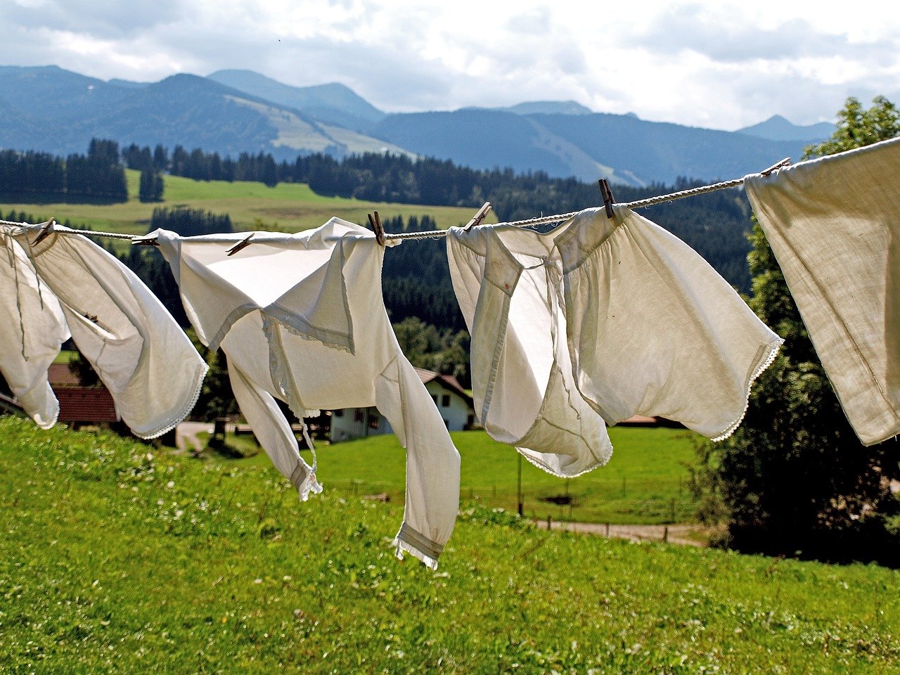 Do clothes dry faster on a windy day or on a sunny day?